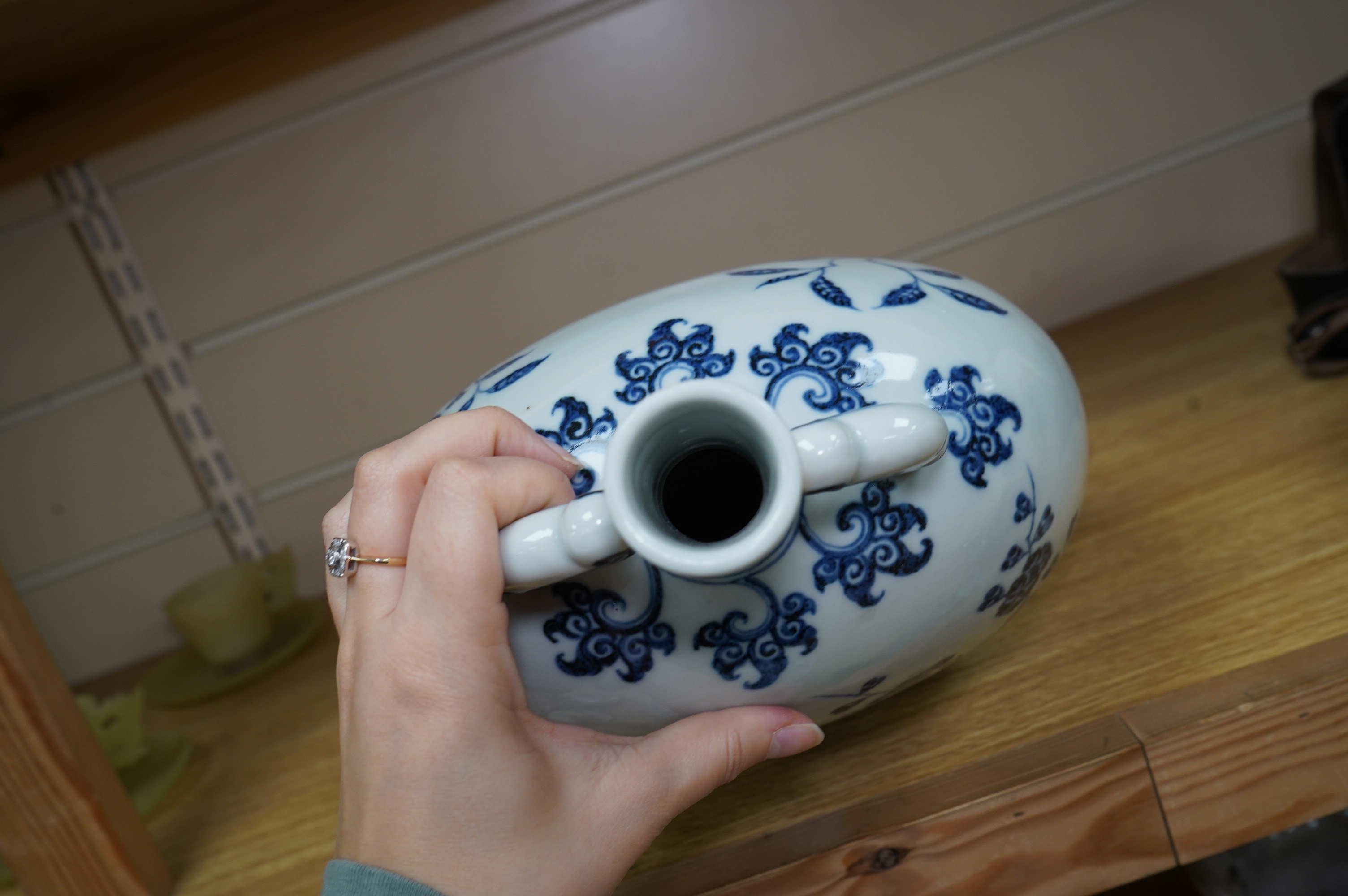 A Chinese blue and white two handled moon flask, decorated with birds on on branches, 29cm high. Condition - good